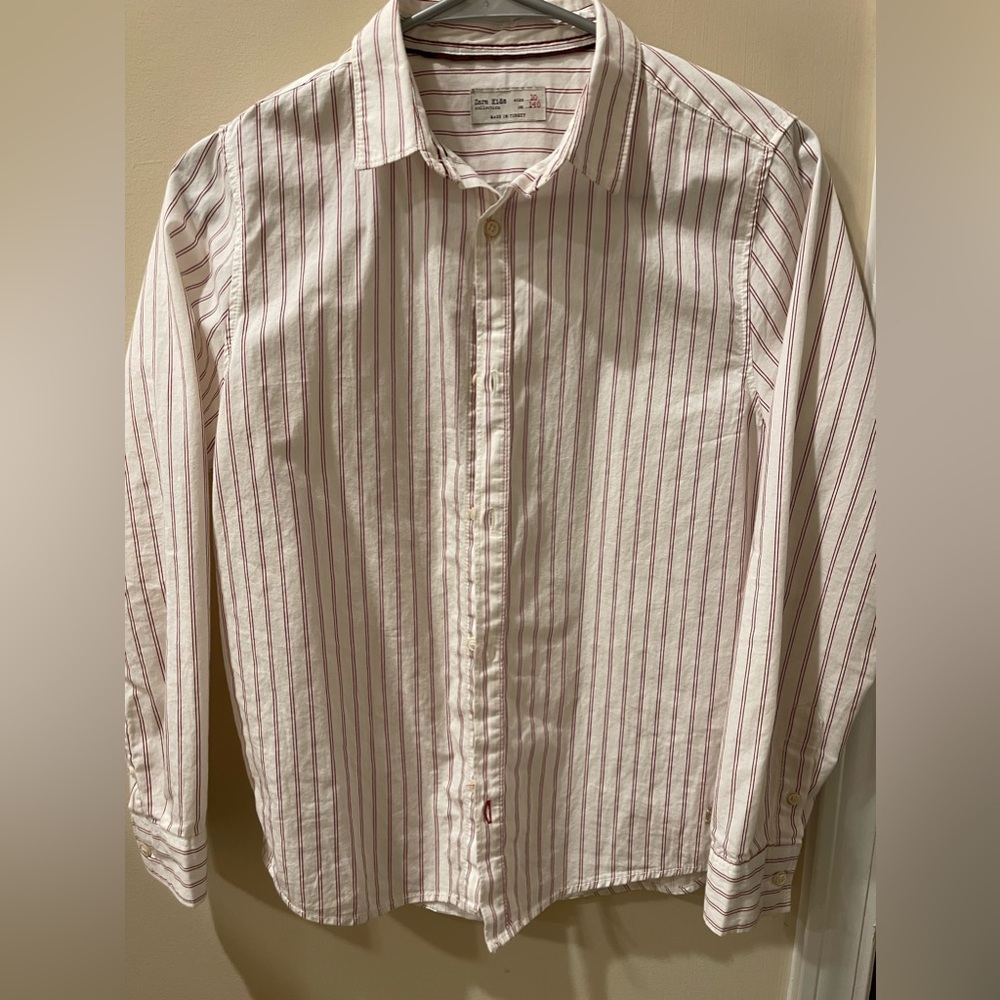 A button down shirt from Zara kids collection for boys in white and red